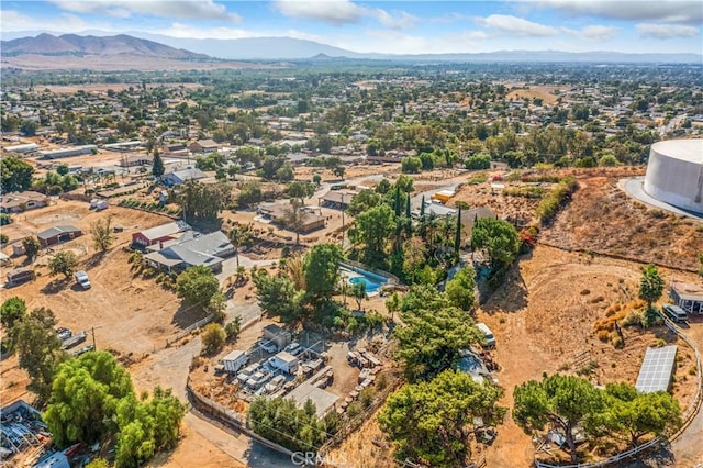 birds eye view of property with a mountain view