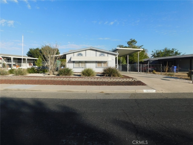 view of front facade with a carport