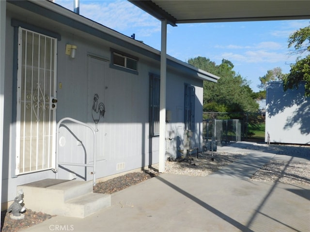 doorway to property featuring a patio area