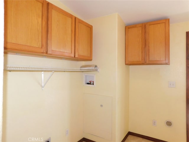 laundry area featuring washer hookup and cabinets