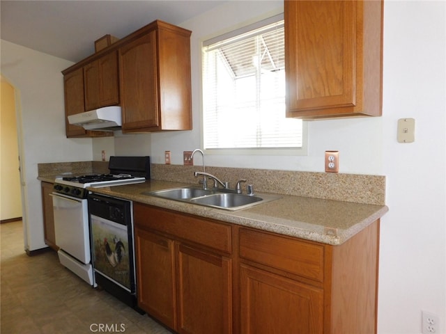 kitchen featuring black dishwasher, white gas stove, and sink