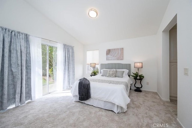 bedroom with light carpet, access to outside, and vaulted ceiling