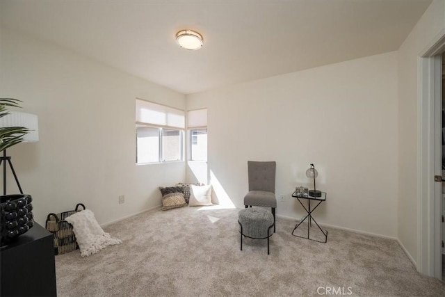 sitting room with light colored carpet