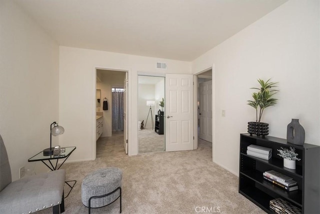 sitting room with light colored carpet