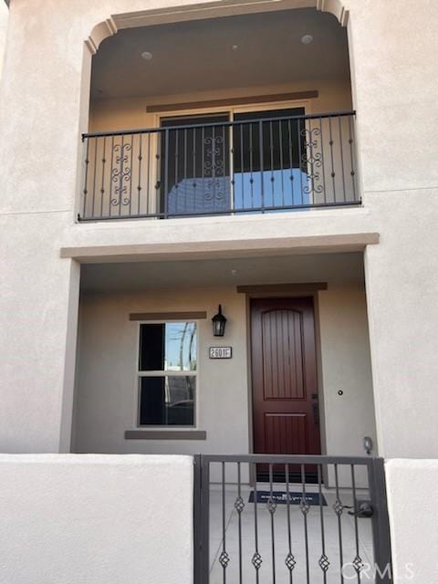 entrance to property featuring a balcony