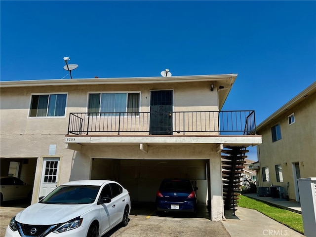 exterior space with a balcony and a garage