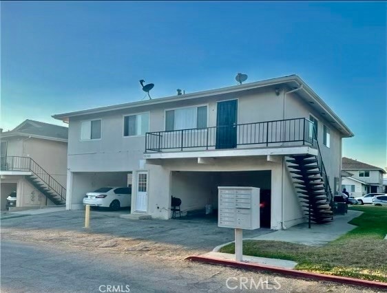 rear view of house with a carport