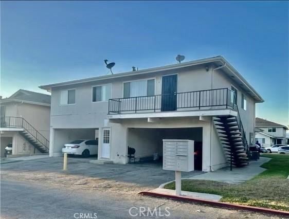 rear view of house with a carport