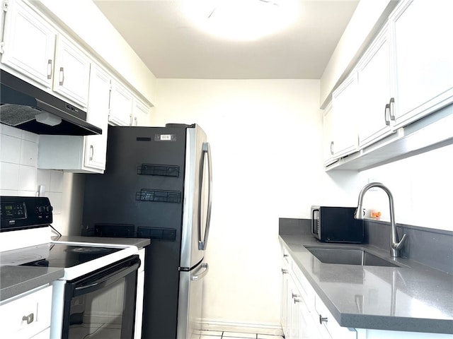 kitchen featuring tile patterned flooring, tasteful backsplash, sink, white cabinets, and white range with electric cooktop