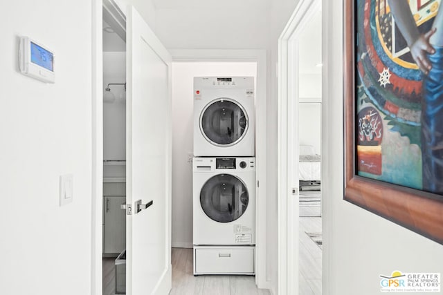 laundry room with stacked washer and clothes dryer