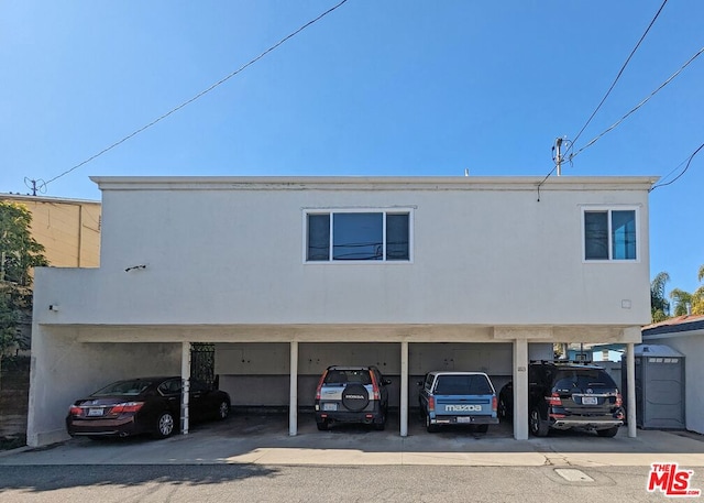 view of front facade with a carport