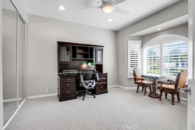 office area with carpet and ceiling fan