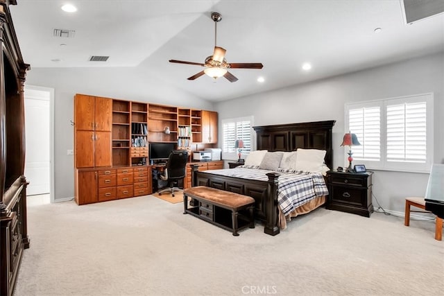 bedroom featuring lofted ceiling, ceiling fan, and light colored carpet