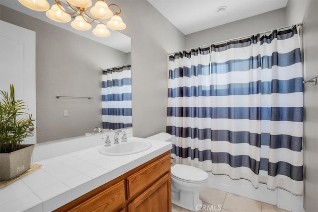 full bathroom with shower / bath combo with shower curtain, vanity, tile patterned flooring, toilet, and a notable chandelier