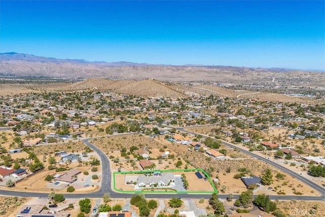 birds eye view of property featuring a mountain view