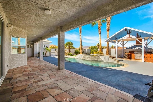 view of pool featuring a hot tub and a patio area