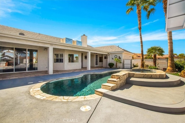 view of pool with an in ground hot tub and a patio area