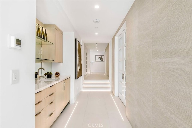 11 Seabreeze Ter, Dana Point, CA 92629 - hallway featuring a sink, light tile patterned flooring, and recessed lighting