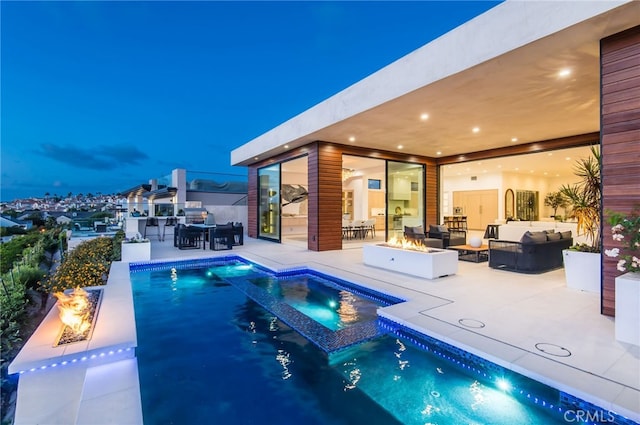 view of pool featuring a patio, an in ground hot tub, and outdoor lounge area