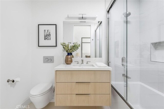 11 Seabreeze Ter, Dana Point, CA 92629 - bathroom with toilet, vanity, and combined bath / shower with glass door