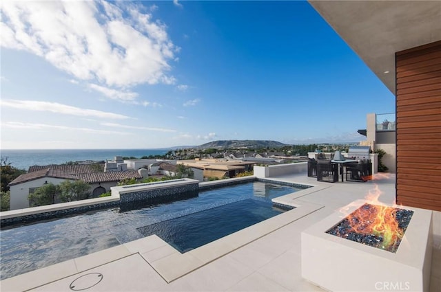 11 Seabreeze Ter, Dana Point, CA 92629 - swimming pool featuring a fire pit, a patio, and outdoor dining space