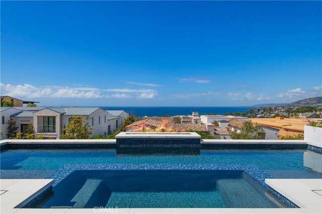 11 Seabreeze Ter, Dana Point, CA 92629 - view of swimming pool featuring a pool with connected hot tub