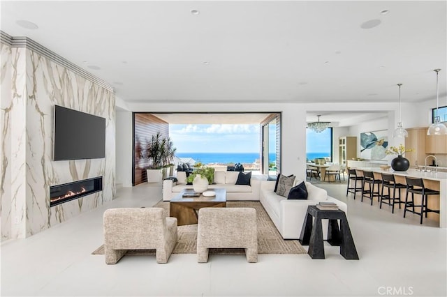 11 Seabreeze Ter, Dana Point, CA 92629 - living room featuring a high end fireplace and a chandelier