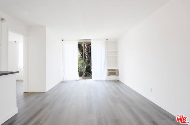 spare room with light hardwood / wood-style floors