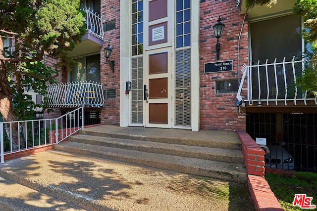 property entrance with a balcony