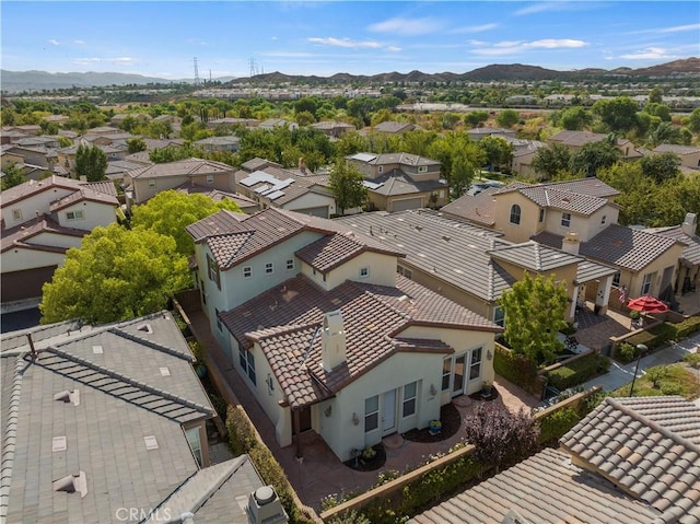 birds eye view of property with a mountain view