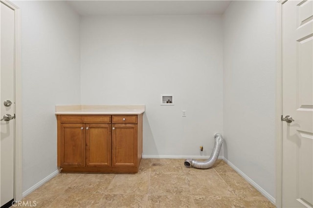 laundry area with washer hookup and cabinets