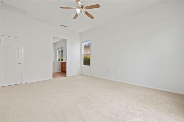 carpeted empty room with ceiling fan