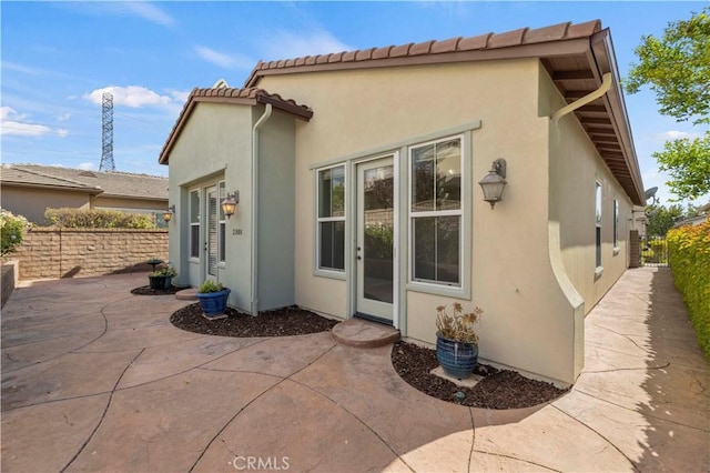 rear view of house featuring a patio