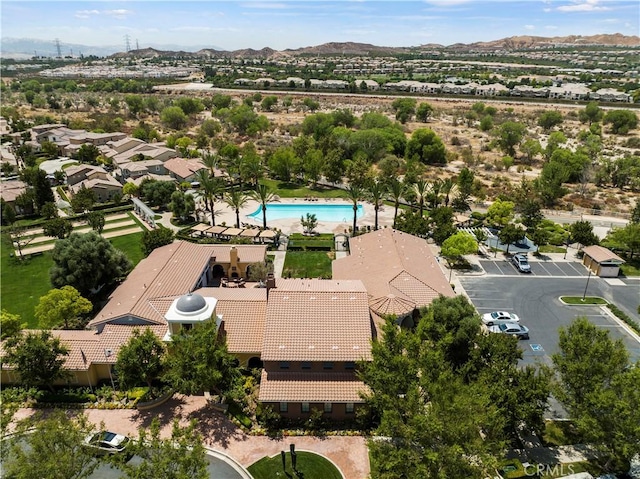 birds eye view of property featuring a mountain view