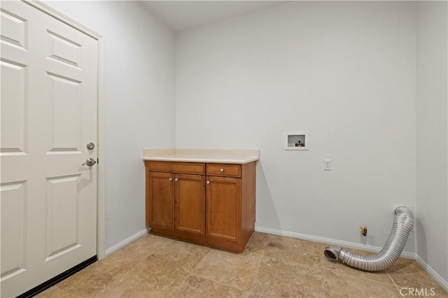 laundry area with hookup for a gas dryer, hookup for a washing machine, and cabinets