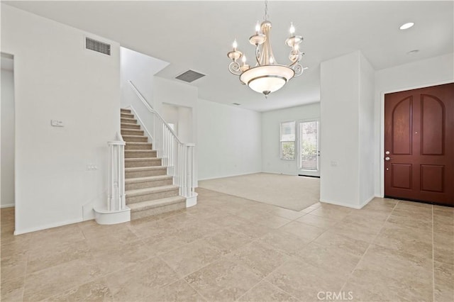 entryway featuring a notable chandelier