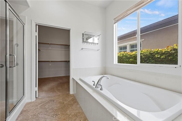 bathroom with shower with separate bathtub