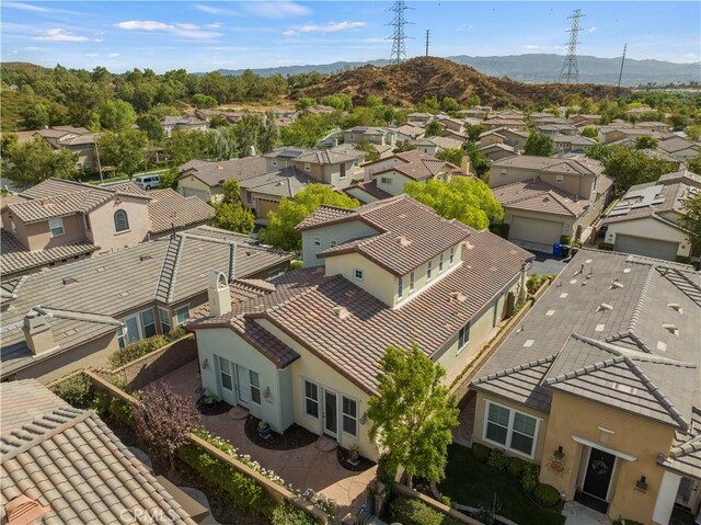 birds eye view of property featuring a mountain view