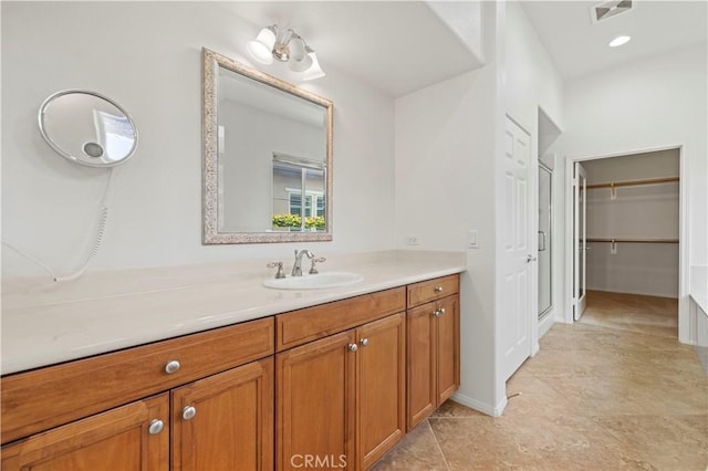 bathroom featuring tile patterned flooring and vanity