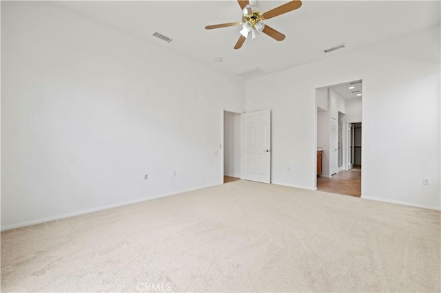 spare room with carpet and ceiling fan