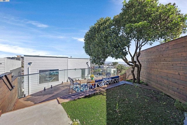 view of yard with a wooden deck