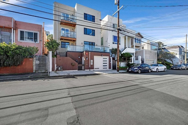 view of front of house featuring a balcony