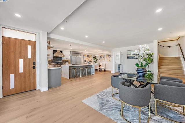 living room with light hardwood / wood-style flooring