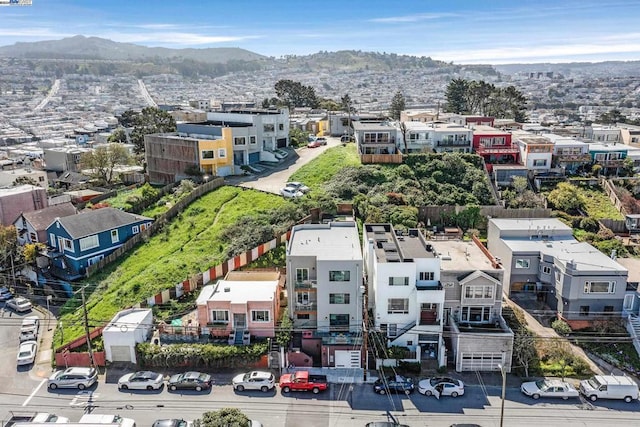 birds eye view of property with a mountain view