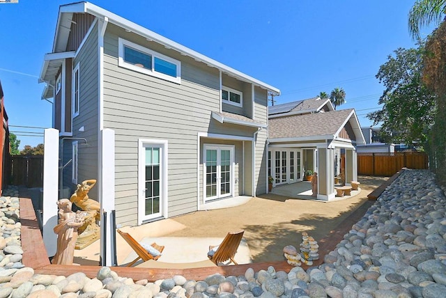 rear view of property featuring a patio area