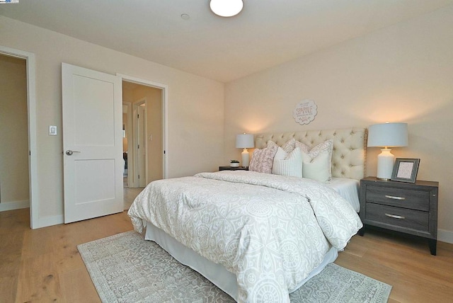 bedroom with light hardwood / wood-style flooring