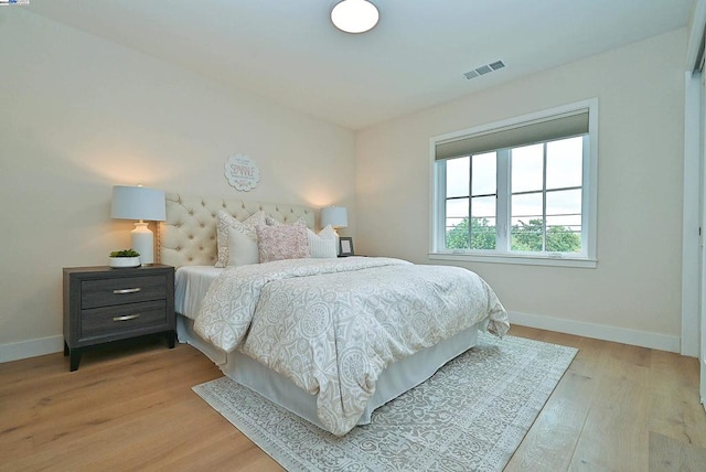 bedroom with light hardwood / wood-style flooring