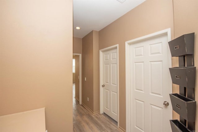 corridor featuring light hardwood / wood-style flooring