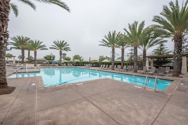 view of swimming pool with a patio