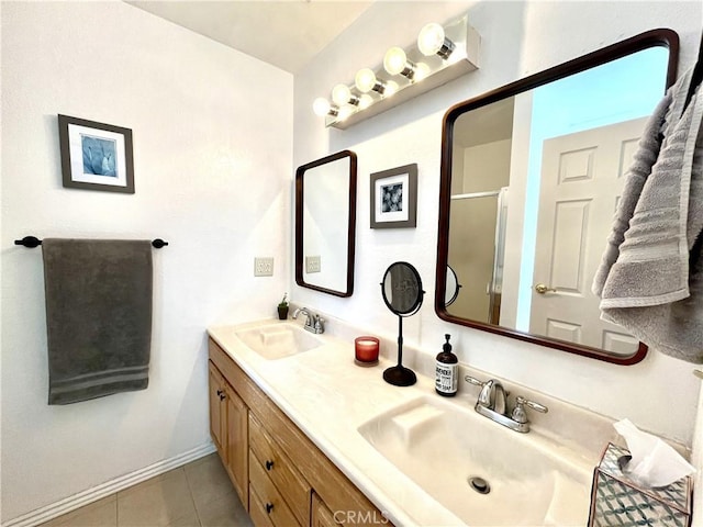 full bathroom featuring tile patterned flooring, a sink, a shower with shower door, and double vanity